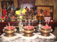 Burning josh sticks placed at the Jui Tui Shrine