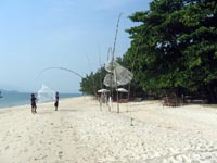 local fishermen prepare traps ready for when the tide comes in